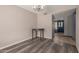 Inviting dining room with wood floors, a chandelier, and neutral walls at 1123 W Mendoza Ave, Mesa, AZ 85210