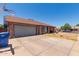 Brick exterior home features a basketball hoop and large driveway at 1123 W Mendoza Ave, Mesa, AZ 85210