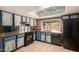 Traditional kitchen featuring light-colored cabinets, dark countertops, and modern appliances at 1123 W Mendoza Ave, Mesa, AZ 85210