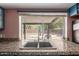Kitchen sink with a granite countertop and a large window overlooking the backyard at 1123 W Mendoza Ave, Mesa, AZ 85210