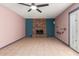 Comfortable living room featuring a brick fireplace, tile floors, and neutral walls at 1123 W Mendoza Ave, Mesa, AZ 85210
