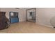 A living room featuring a piano, hutch, and entry to another room at 1123 W Mendoza Ave, Mesa, AZ 85210