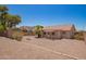 Desert landscaped backyard with a shed, covered patio, and plenty of space for outdoor activities at 11352 E Dartmouth St, Mesa, AZ 85207