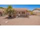 Private backyard featuring a covered patio, desert landscaping, and a charming, low-maintenance space at 11352 E Dartmouth St, Mesa, AZ 85207