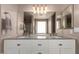 Bathroom featuring a double sink vanity with granite countertop and a large mirror at 11352 E Dartmouth St, Mesa, AZ 85207