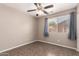 Bedroom with a window providing natural light and tile floors at 11352 E Dartmouth St, Mesa, AZ 85207
