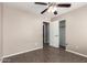 Bedroom showcasing an open closet and a glimpse into the en-suite bathroom at 11352 E Dartmouth St, Mesa, AZ 85207