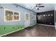 Bonus room featuring custom wall decor, windows, vinyl floors, and a ceiling fan at 11352 E Dartmouth St, Mesa, AZ 85207