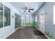 Bonus room with custom wall decor, windows, vinyl floors, and a ceiling fan at 11352 E Dartmouth St, Mesa, AZ 85207