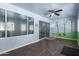 Bonus room with sliding glass doors, vinyl floors, a ceiling fan and custom decor at 11352 E Dartmouth St, Mesa, AZ 85207