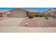 Charming single-story home with a well-maintained front yard, complemented by a two-car garage and a beautiful desert landscape at 11352 E Dartmouth St, Mesa, AZ 85207