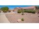 Inviting single-Gathering home featuring desert landscaping and a two-car garage, creating a warm and welcoming curb appeal at 11352 E Dartmouth St, Mesa, AZ 85207