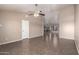 Bright and open living room features tile flooring, a ceiling fan, and neutral-toned walls at 11352 E Dartmouth St, Mesa, AZ 85207