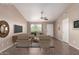 Neutral living room showcasing modern decor, including comfortable seating and a view of the outdoors at 11352 E Dartmouth St, Mesa, AZ 85207