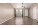 Living room with tile flooring, a ceiling fan, neutral paint, and a window for natural light at 11352 E Dartmouth St, Mesa, AZ 85207