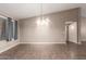Bright living area showcasing vaulted ceilings and updated lighting fixtures for elegant living at 11352 E Dartmouth St, Mesa, AZ 85207