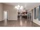 Spacious living area with tile flooring, seamlessly connects to the kitchen and a sliding glass door to the backyard at 11352 E Dartmouth St, Mesa, AZ 85207