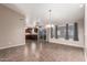 Open-concept space with tile flooring, flowing into the kitchen area and sliding door to the backyard at 11352 E Dartmouth St, Mesa, AZ 85207