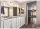 Main bathroom with dual sinks, updated fixtures, and tile flooring, designed for contemporary living at 11352 E Dartmouth St, Mesa, AZ 85207