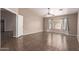 Bright main bedroom featuring tile flooring and a bay window, perfect for a serene retreat at 11352 E Dartmouth St, Mesa, AZ 85207