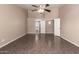 Spacious main bedroom with ceiling fan and tile flooring, providing a comfortable and functional design at 11352 E Dartmouth St, Mesa, AZ 85207