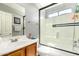 Bathroom featuring a glass-enclosed shower and vanity at 12325 W Dreyfus Dr, El Mirage, AZ 85335