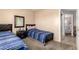 Shared bedroom with carpet, beds, and closet at 12325 W Dreyfus Dr, El Mirage, AZ 85335