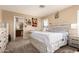Bedroom featuring a dresser, bed, window, and carpet at 12325 W Dreyfus Dr, El Mirage, AZ 85335