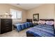 Bright bedroom with matching twin beds, and closet at 12325 W Dreyfus Dr, El Mirage, AZ 85335