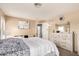 Bedroom featuring a large dresser, window, and cozy carpet at 12325 W Dreyfus Dr, El Mirage, AZ 85335