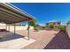 Enjoy the Arizona weather from the covered patio overlooking the desert landscaping and backyard at 12325 W Dreyfus Dr, El Mirage, AZ 85335