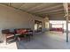 Relaxing covered patio with comfortable seating, perfect for outdoor lounging and entertaining at 12325 W Dreyfus Dr, El Mirage, AZ 85335