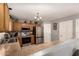Well-equipped kitchen boasts stainless steel appliances, ample counter space, and modern lighting fixtures at 12325 W Dreyfus Dr, El Mirage, AZ 85335