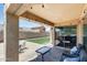 Outdoor patio area features a tiled floor, covered overhang and plenty of space for entertaining at 1397 E Laurel Pl, Casa Grande, AZ 85122