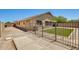 Spacious backyard features artificial grass, a dog run and a barbecue and entertaining area at 1397 E Laurel Pl, Casa Grande, AZ 85122