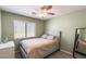 Comfortable bedroom featuring a ceiling fan, a window, and neutral decor at 1397 E Laurel Pl, Casa Grande, AZ 85122