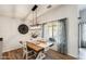 Stylish dining room with a modern light fixture and a farmhouse-style table at 1397 E Laurel Pl, Casa Grande, AZ 85122