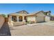 Inviting single-story home with a charming front porch and well-maintained desert landscaping at 1397 E Laurel Pl, Casa Grande, AZ 85122