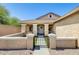 Charming home with a welcoming front porch, complemented by lovely plants and well-kept landscaping at 1397 E Laurel Pl, Casa Grande, AZ 85122