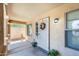 Inviting front porch with decorative wreath, desert landscaping, and security door at 1397 E Laurel Pl, Casa Grande, AZ 85122