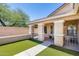 Inviting covered front porch with decorative columns and landscaped surroundings at 1397 E Laurel Pl, Casa Grande, AZ 85122