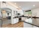 Bright kitchen boasts white cabinetry, stainless steel appliances, and an open layout at 1397 E Laurel Pl, Casa Grande, AZ 85122