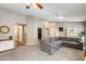 Comfortable living room with a plush gray sectional sofa and neutral decor at 1397 E Laurel Pl, Casa Grande, AZ 85122
