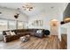 Spacious living room featuring a large sectional sofa, high ceilings, and neutral decor at 1397 E Laurel Pl, Casa Grande, AZ 85122