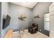 Relaxing sitting room with comfortable leather chair, tv and gray walls at 1397 E Laurel Pl, Casa Grande, AZ 85122