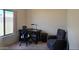 Bright bedroom features a desk, office chair, and comfortable upholstered chair at 14214 N Galatea Dr # A, Fountain Hills, AZ 85268