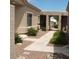 Exterior view of a side yard with pavers, gravel, and stucco walls leading to a front entry way at 14214 N Galatea Dr # A, Fountain Hills, AZ 85268
