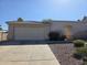 A single story home featuring a stucco exterior, a two car garage, and a desert landscape at 14214 N Galatea Dr # A, Fountain Hills, AZ 85268