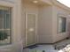 Close-up view of the home's front door and windows showing stucco exterior and desert landscaping at 14214 N Galatea Dr # A, Fountain Hills, AZ 85268