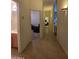 Hallway with tile flooring leads to bedroom and bathroom; natural light from open doorways at 14214 N Galatea Dr # A, Fountain Hills, AZ 85268